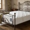 Materasso Manifattura Falomo Sbadiglio Ortopedico ambientato letto ferro battuto
